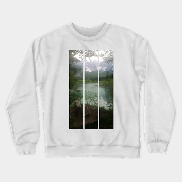 A static shot from the shore of Fusine lake in the Julian Alps with snowy mountains in background and a bench. Beautiful nature in a spring cloudy day; no people around. Italy (vertical) Crewneck Sweatshirt by fabbroni-art